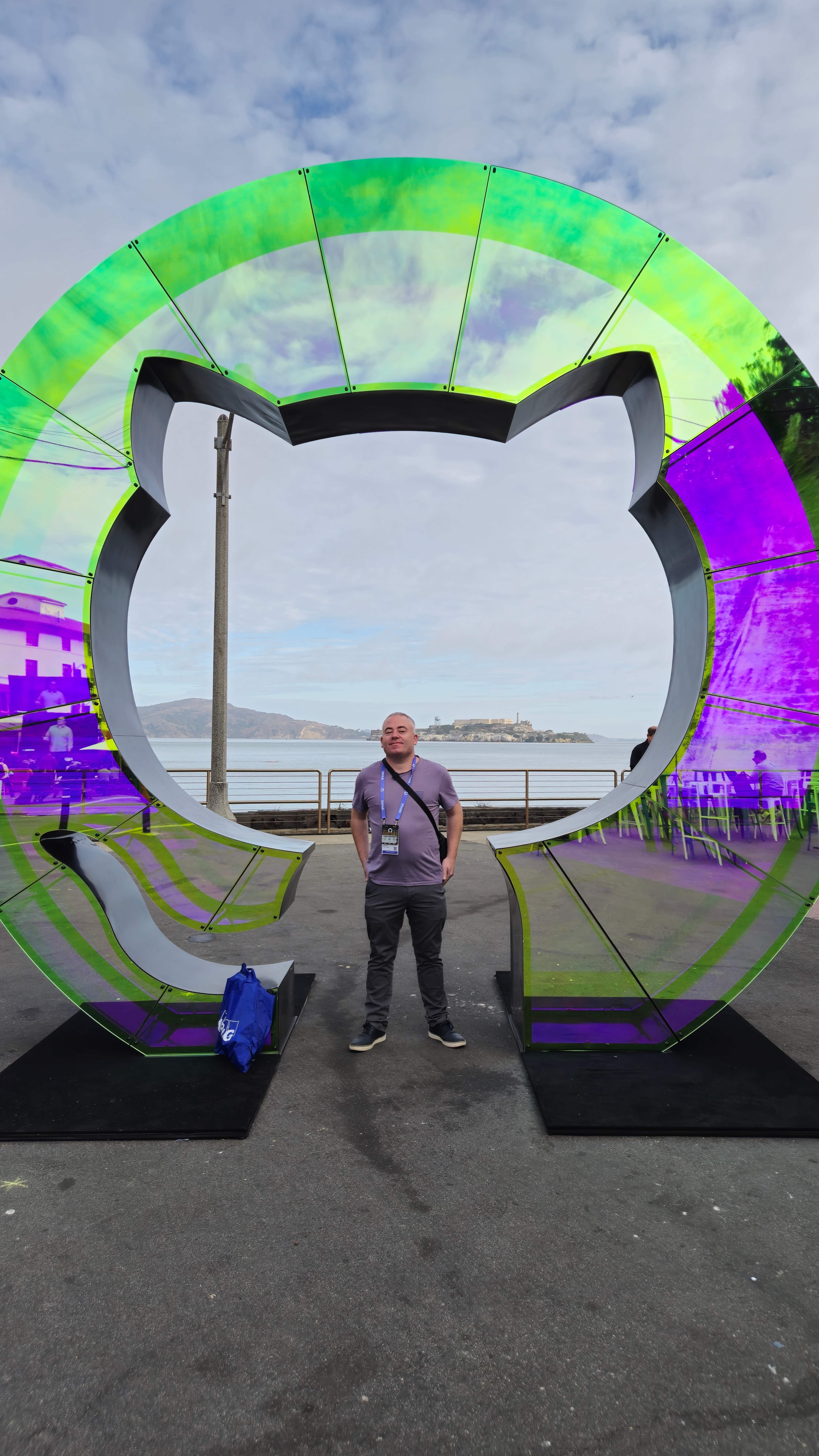 Declan Butler standing in front of a colorful art installation in San Francisco